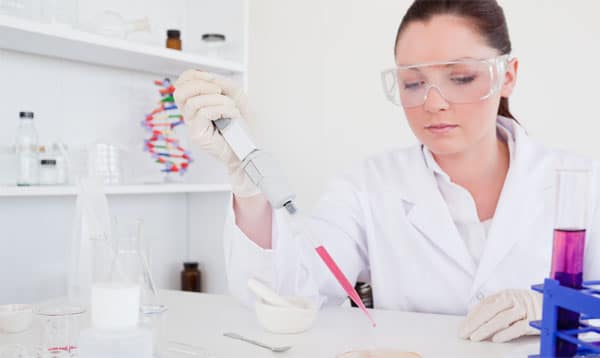 Skilled scientist using a micropipette