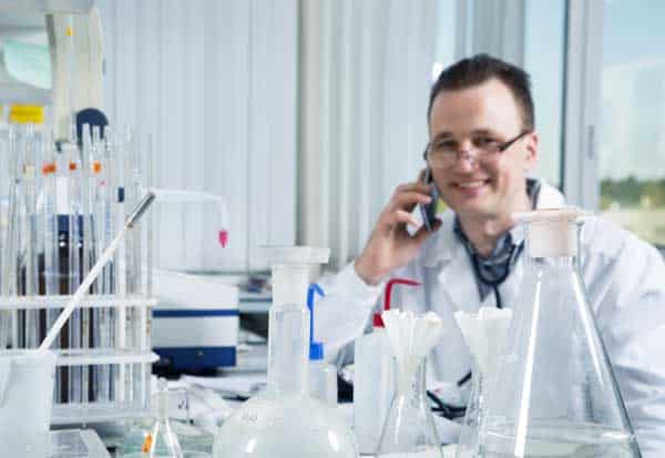 Scientist talking on phone in laboratory