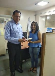 Dr Deepak Bhanot awarding certificate of distinguished service