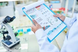 Scientist reviewing statistical data